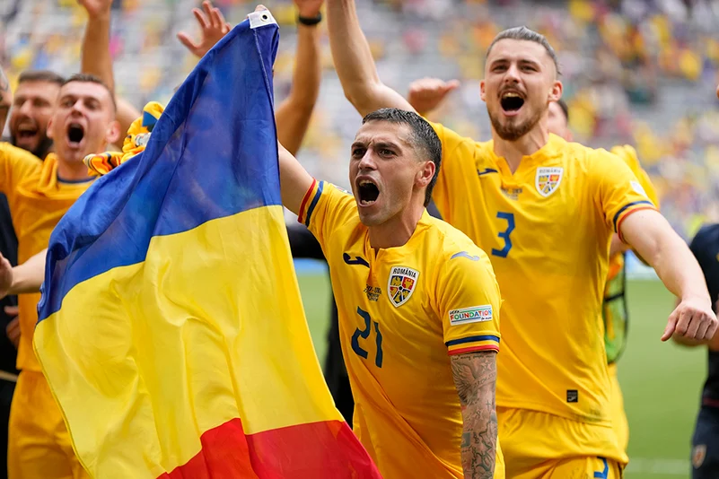 Romania players celebrate their victory over Ukraine